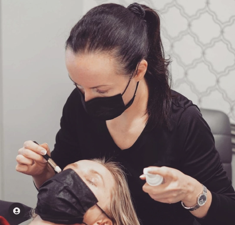 Esthetician providing a professional facial treatment